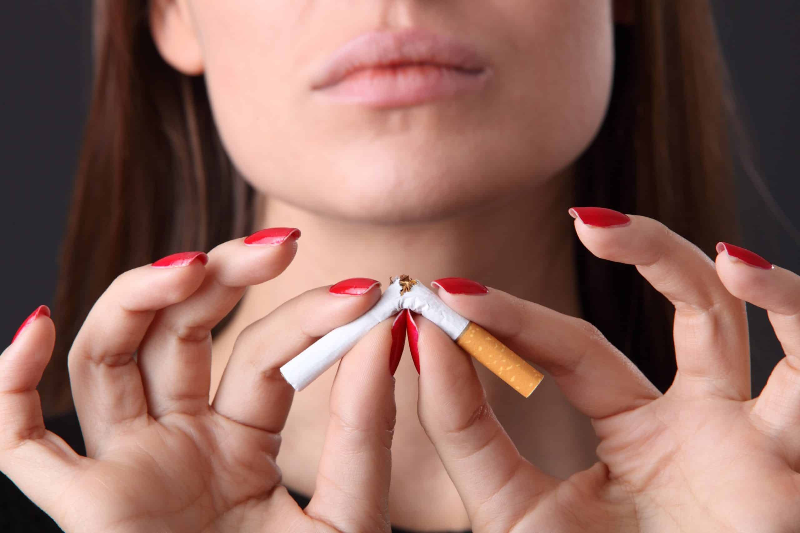 woman and stop smoking cigarette (focus on face)